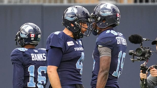 Nov 13, 2022; Toronto, Ontario, CAN; Toronto Argonauts quarterback McLeod Bethel-Thompson (4) and wide receiver Kurleigh Gittens Jr. (19) celebrate their scoring play against the Montreal Alouettes during the second half at BMO Field. Mandatory Credit: John E. Sokolowski-USA TODAY Sports  